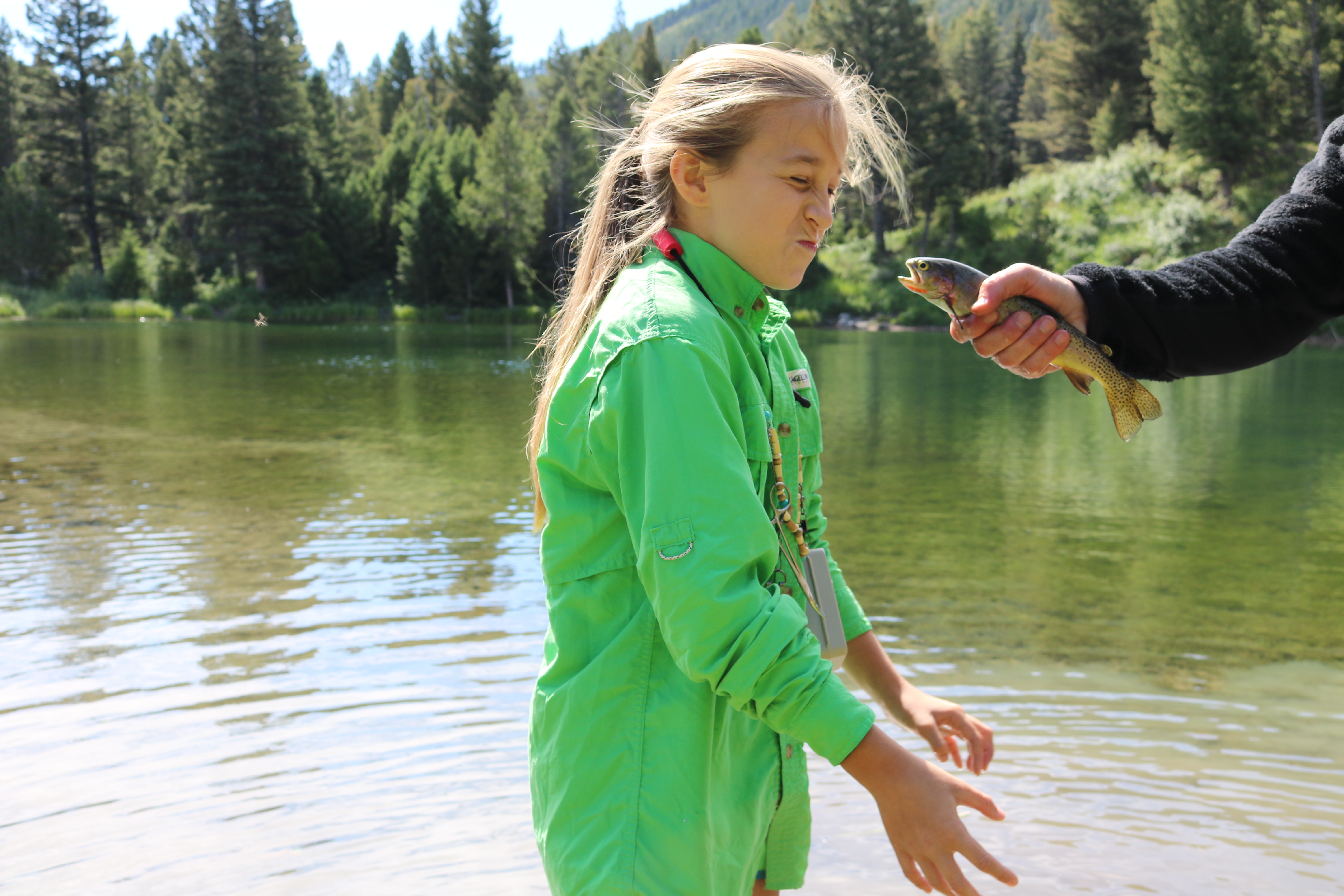 Girl kissing fish - Yellowstone 
